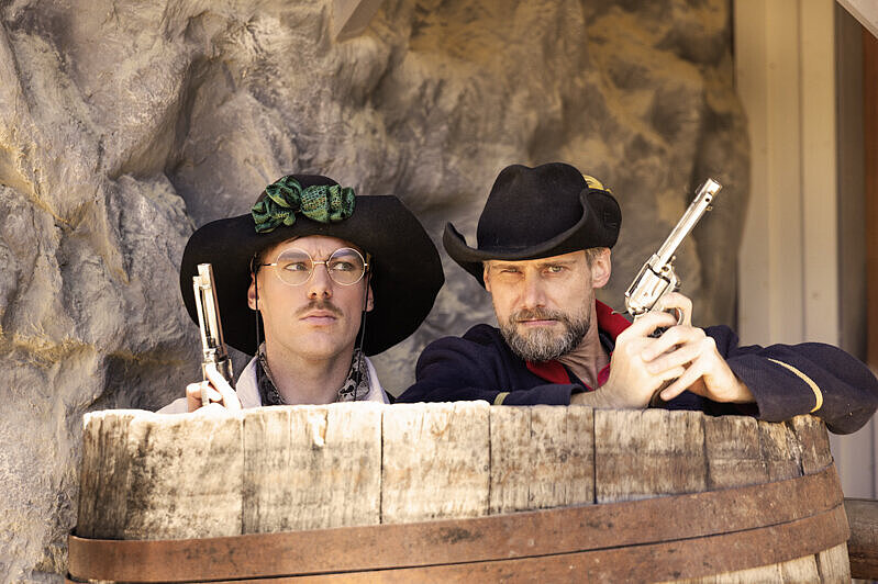 Pullman-Foto bewaffnete Cowboys